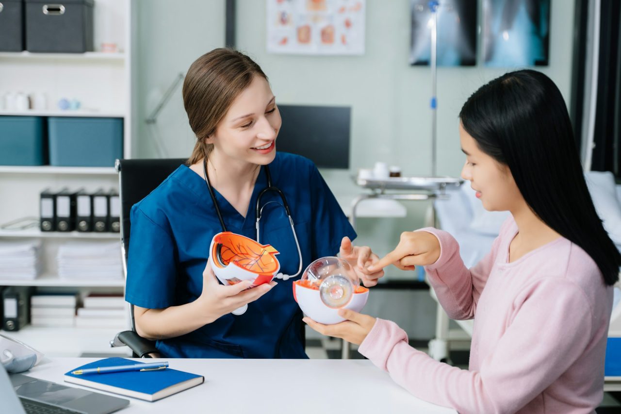 Portrait of female doctor explaining diagnosis to her patient. Doctor Meeting With Patient